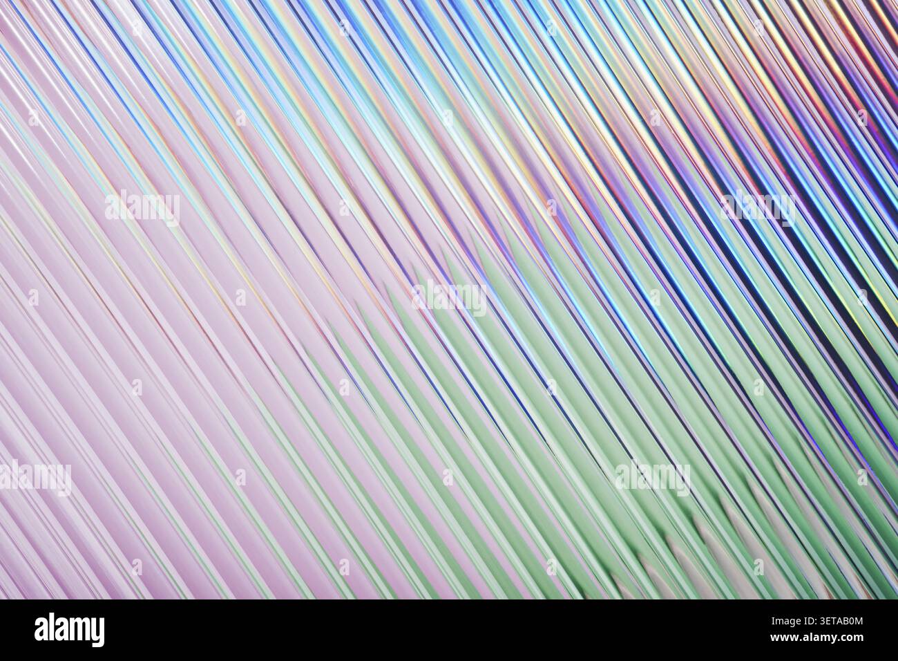 Iridescent ribbed glass background with color gradient, diagonal abstract texture Stock Photo