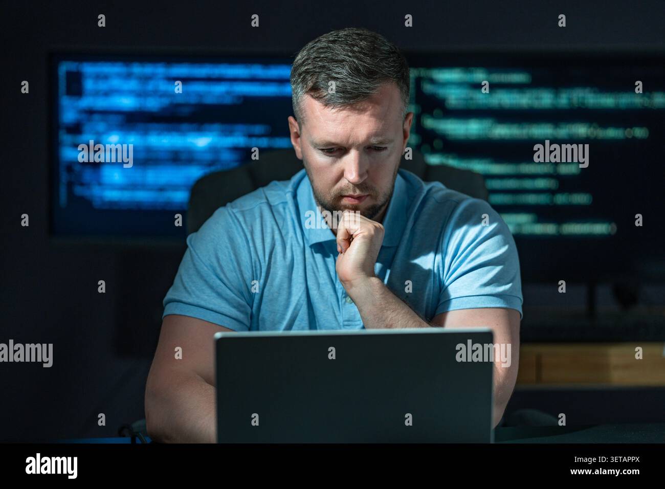 Developer works on secure software. Developer writes protection code system. Developer analyzes network vulnerabilities. Developer prevents cyber Stock Photo