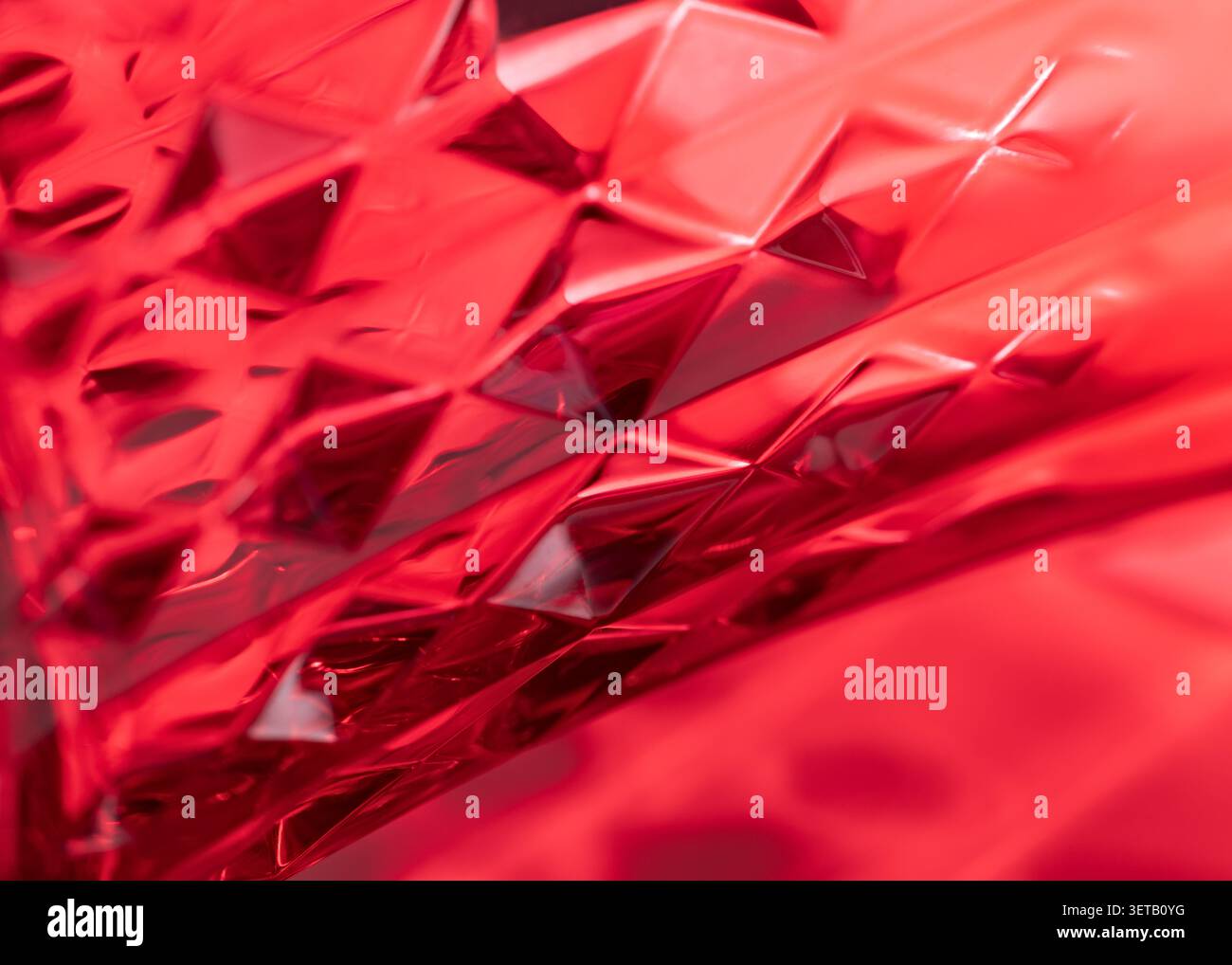 Abstract Geometric Red Pattern - Vibrant Glass Texture with Faceted Diamond Design Stock Photo