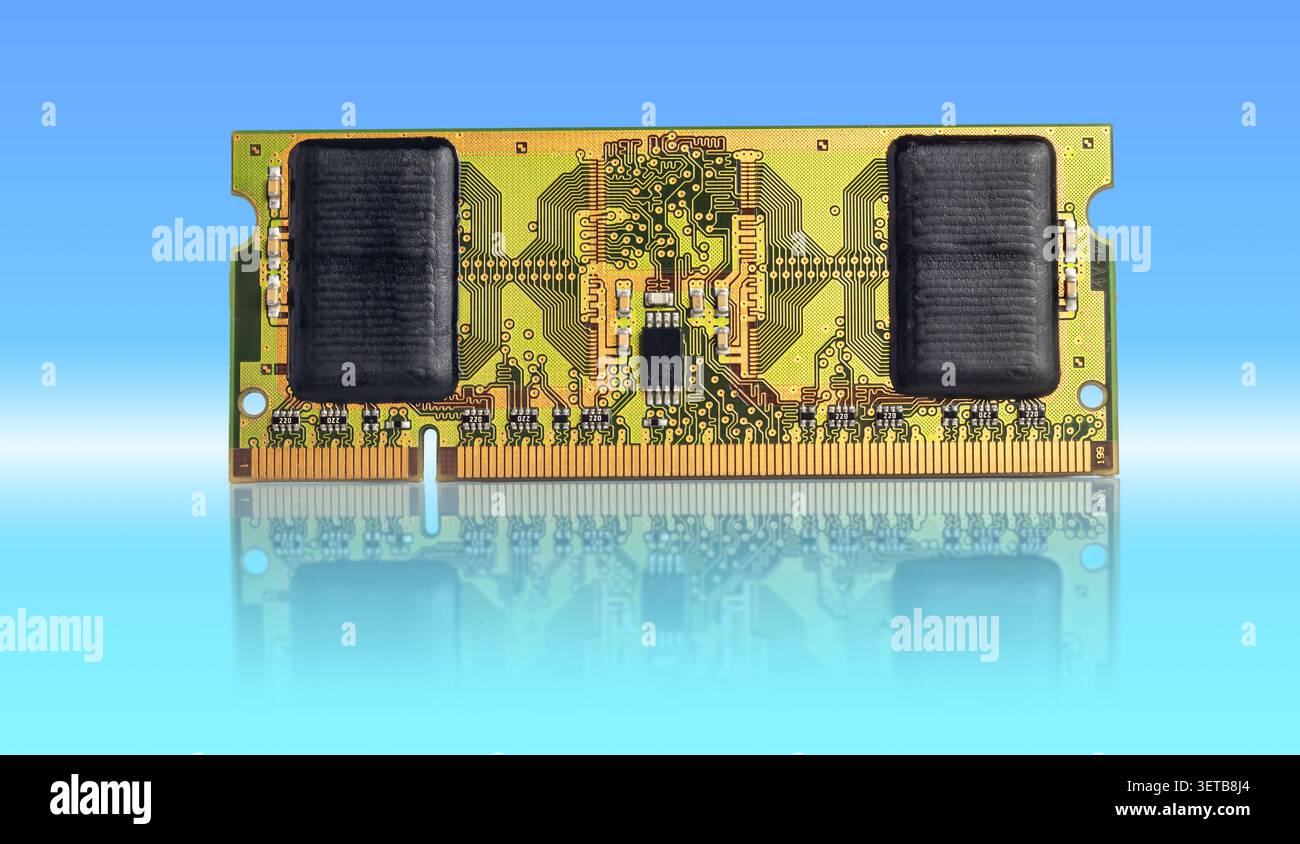 A high-quality RAM memory module rests on a glossy reflective surface against a blue gradient backdrop. Ideal for tech, electronics, and computer hard Stock Photo