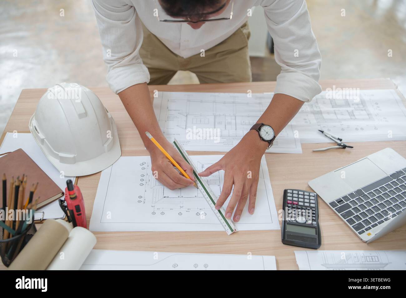 Architect or Engineer Working on Construction Plans with Tools a Stock Photo