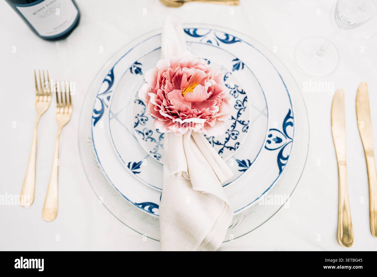 Elegant table setting with white and blue patterned plates Stock Photo