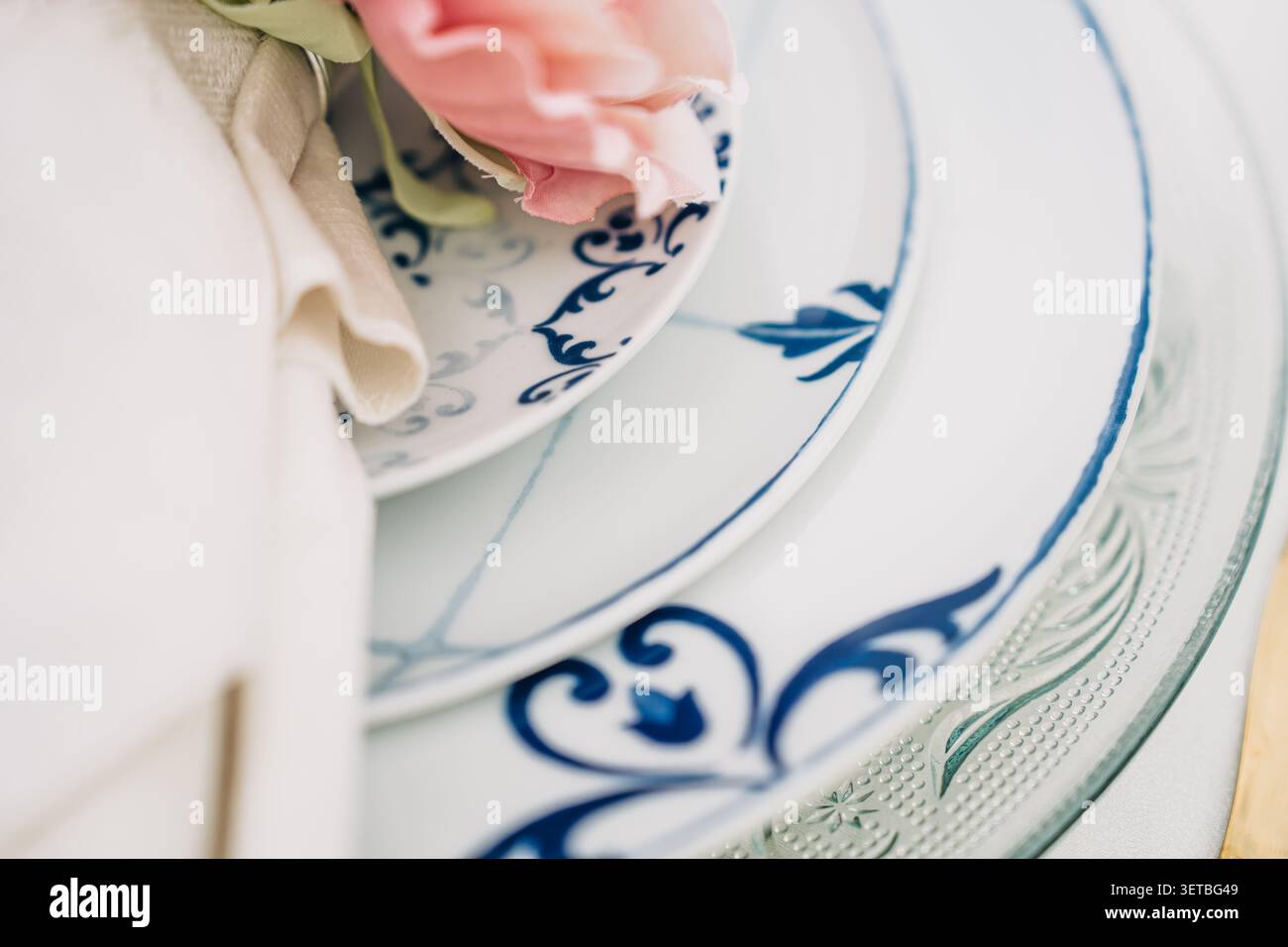 Elegant blue and white plates creating beautiful table setting Stock Photo