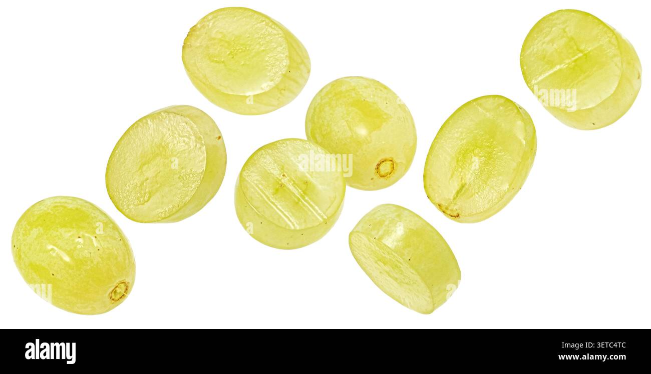Falling green grape slices isolated on white background Stock Photo