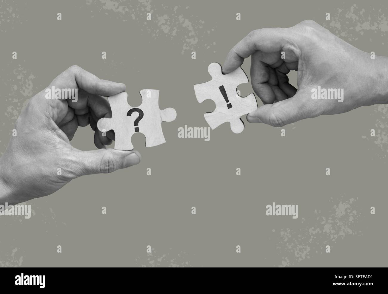 Question and exclamation puzzle piece held by hands for problem solving. Stock Photo