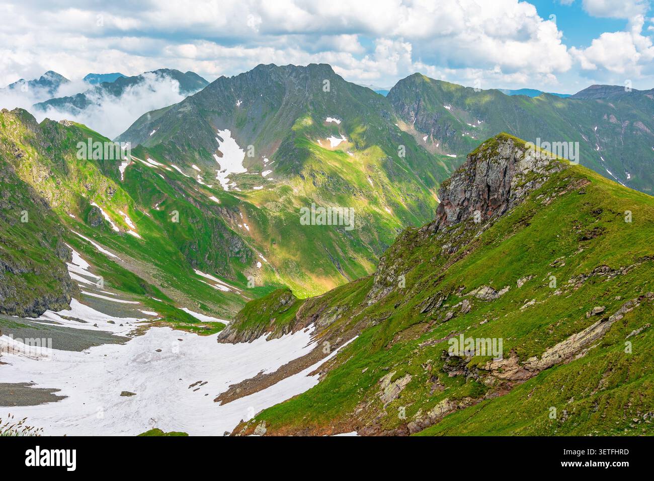 romania mountain landscape in summer. travel background of alpine scenery in fagaras mountain ridge. european summer outdoor adventures Stock Photo