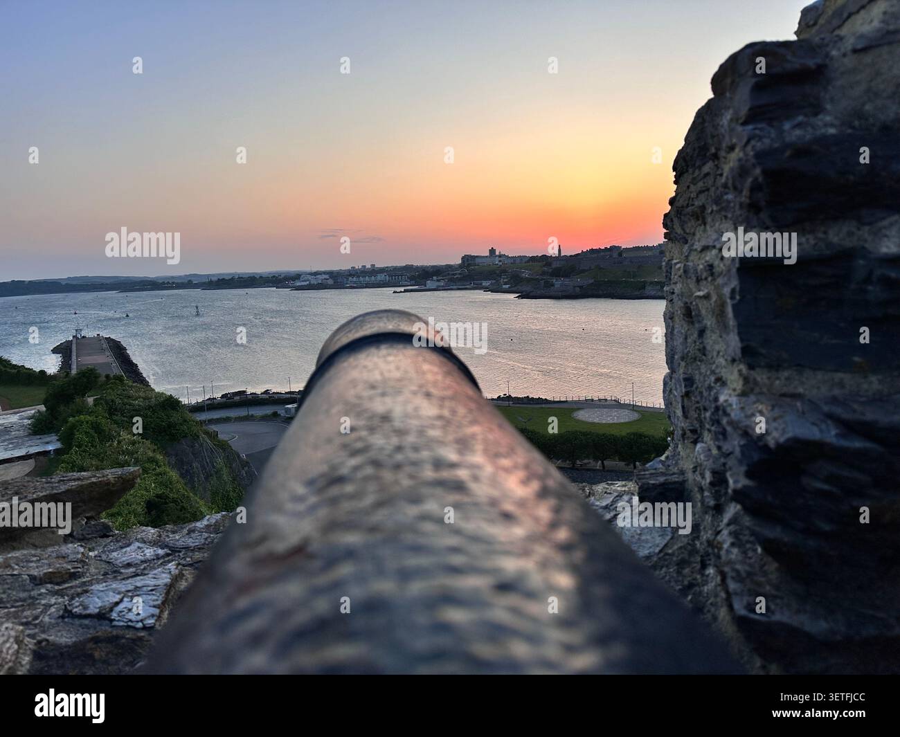 Sunset on the Summer Solstice over Plymouth Sound, England, with a view over Plymouth Hoe. Taken from Mountbatten Castle. - Smartphone Captured Stock Image