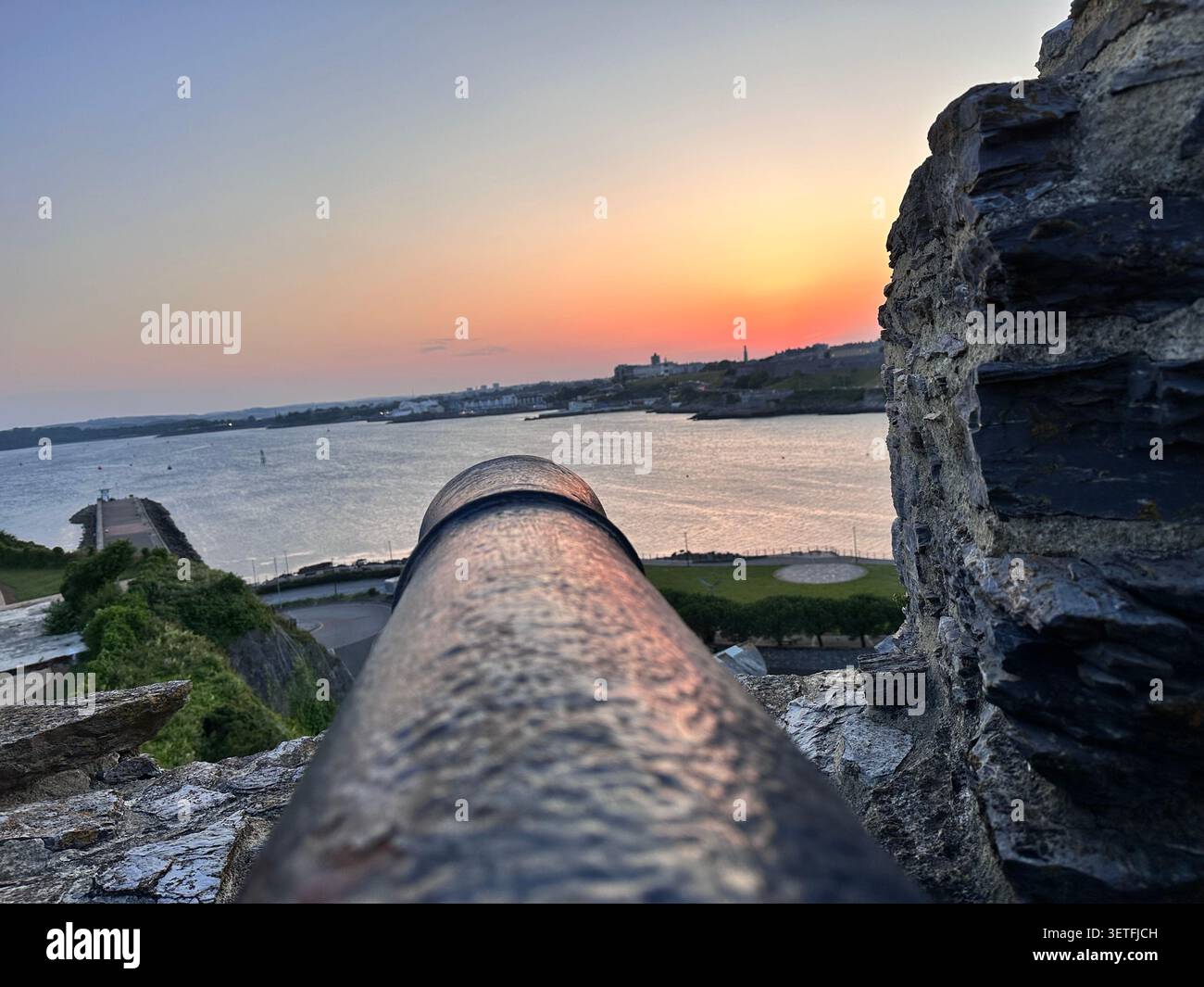 Sunset on the Summer Solstice over Plymouth Sound, England, with a view over Plymouth Hoe. Taken from Mountbatten Castle. - Smartphone Captured Stock Image