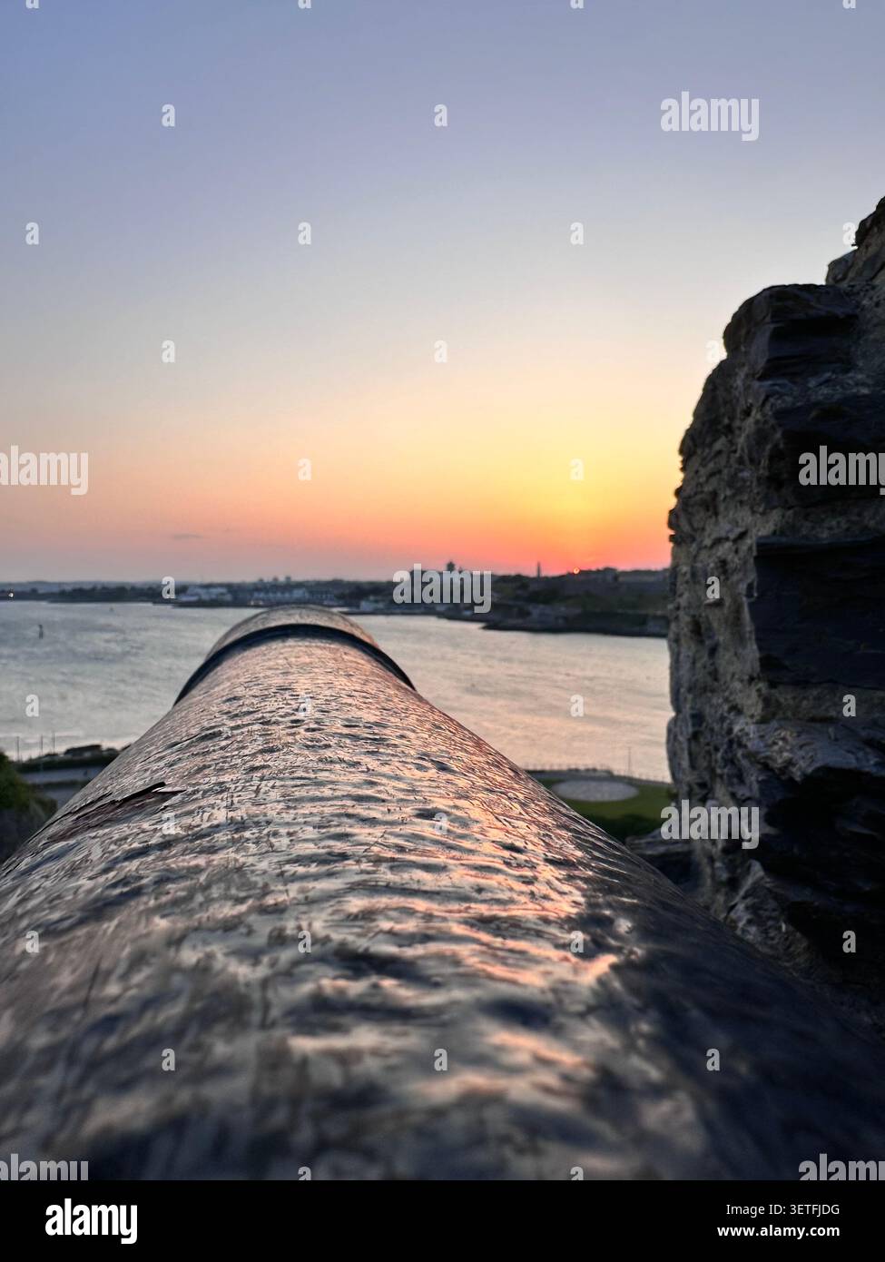 Sunset on the Summer Solstice over Plymouth Sound, England, with a view over Plymouth Hoe. Taken from Mountbatten Castle. - Smartphone Captured Stock Image
