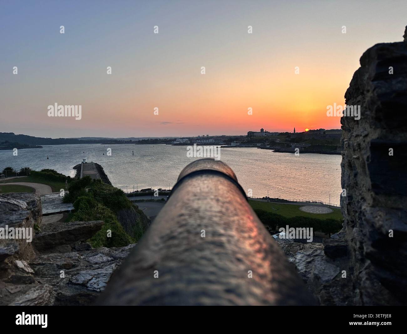 Sunset on the Summer Solstice over Plymouth Sound, England, with a view over Plymouth Hoe. Taken from Mountbatten Castle. - Smartphone Captured Stock Image