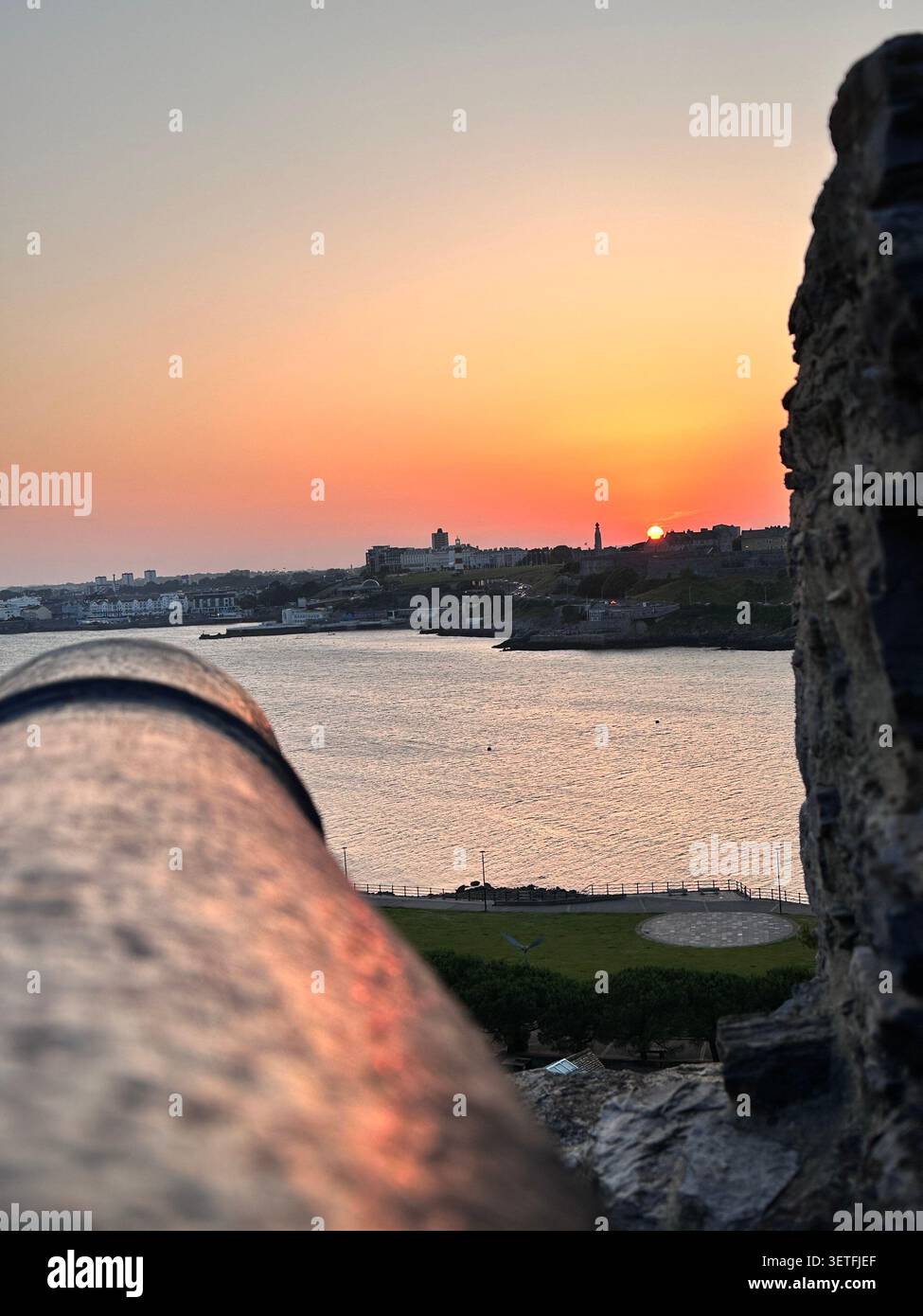 Sunset on the Summer Solstice over Plymouth Sound, England, with a view over Plymouth Hoe. Taken from Mountbatten Castle. - Smartphone Captured Stock Image