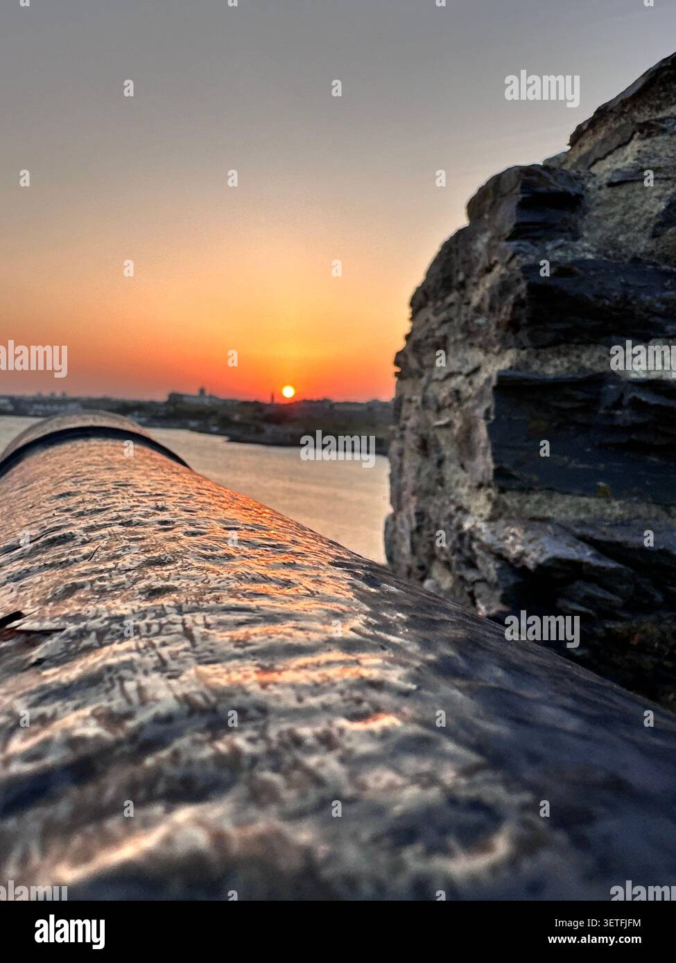 Sunset on the Summer Solstice over Plymouth Sound, England, with a view over Plymouth Hoe. Taken from Mountbatten Castle. - Smartphone Captured Stock Image