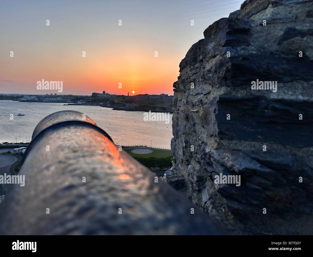 Sunset on the Summer Solstice over Plymouth Sound, England, with a view over Plymouth Hoe. Taken from Mountbatten Castle. - Smartphone Captured Stock Image