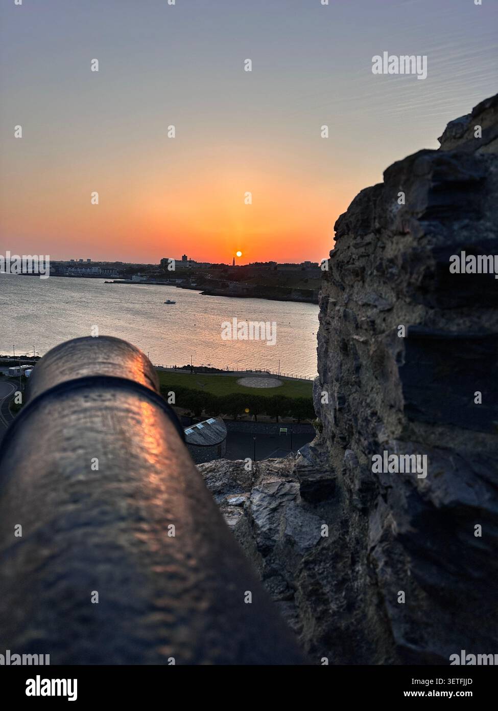 Sunset on the Summer Solstice over Plymouth Sound, England, with a view over Plymouth Hoe. Taken from Mountbatten Castle. - Smartphone Captured Stock Image
