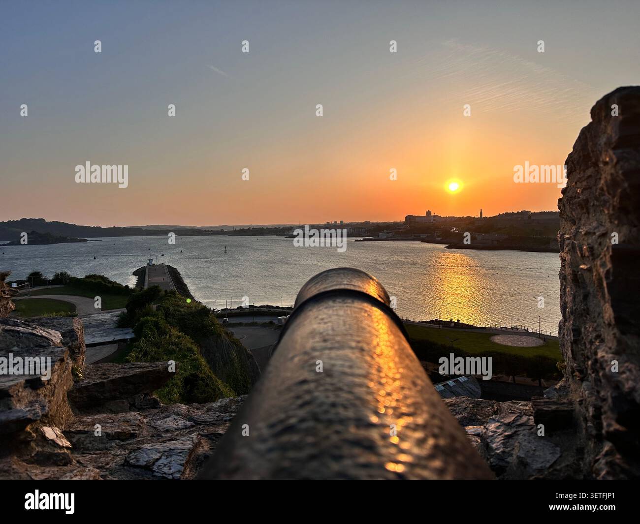 Sunset on the Summer Solstice over Plymouth Sound, England, with a view over Plymouth Hoe. Taken from Mountbatten Castle. - Smartphone Captured Stock Image