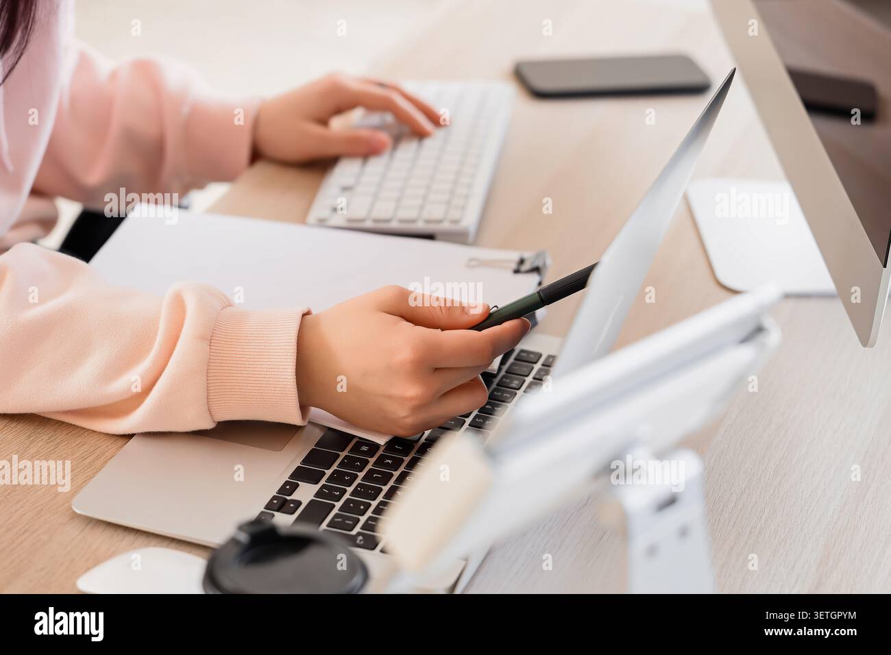 Female programmers hands testing code on laptop in office, closeup Stock Photo