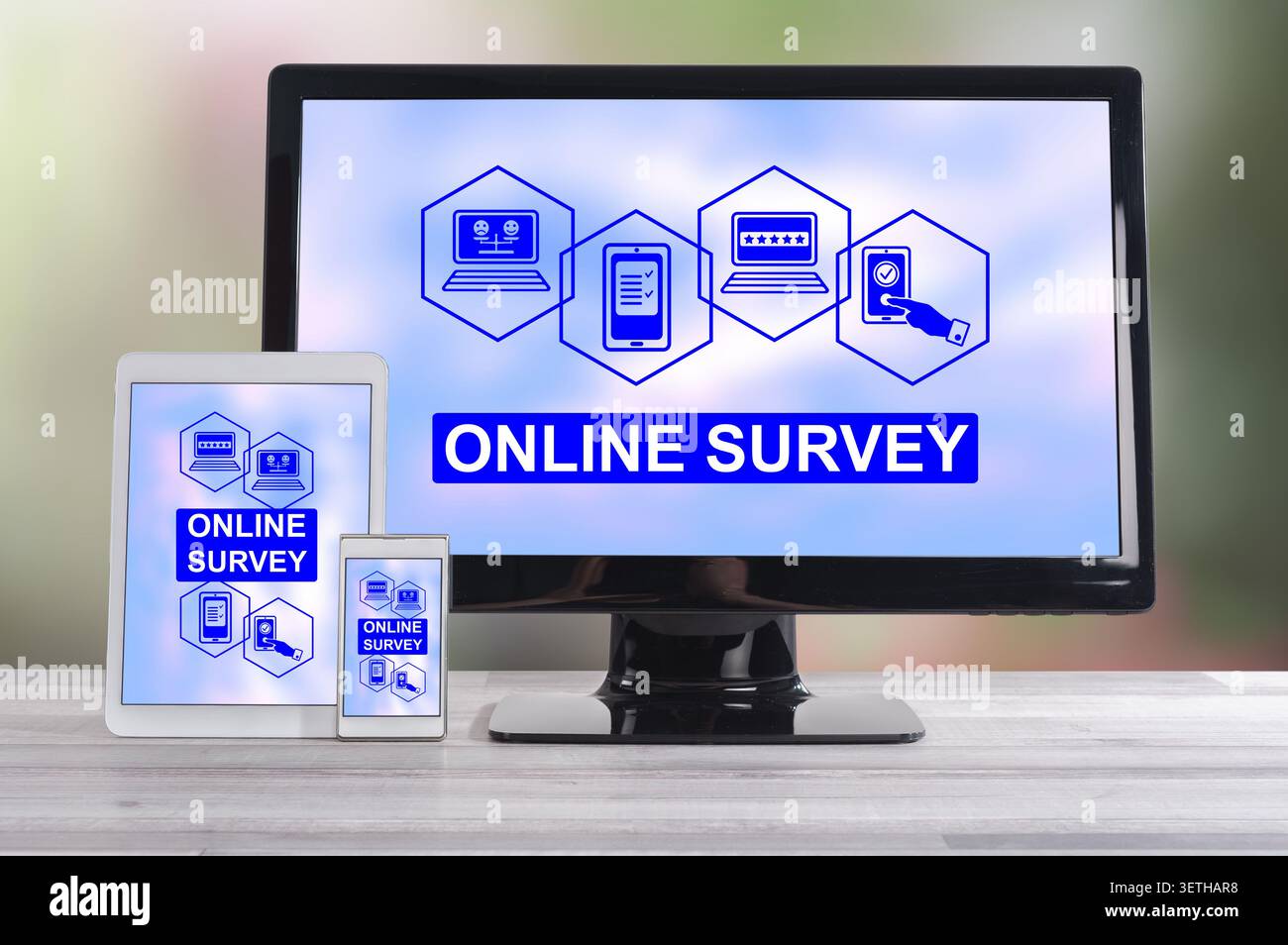 Online survey concept shown on different information technology devices Stock Photo