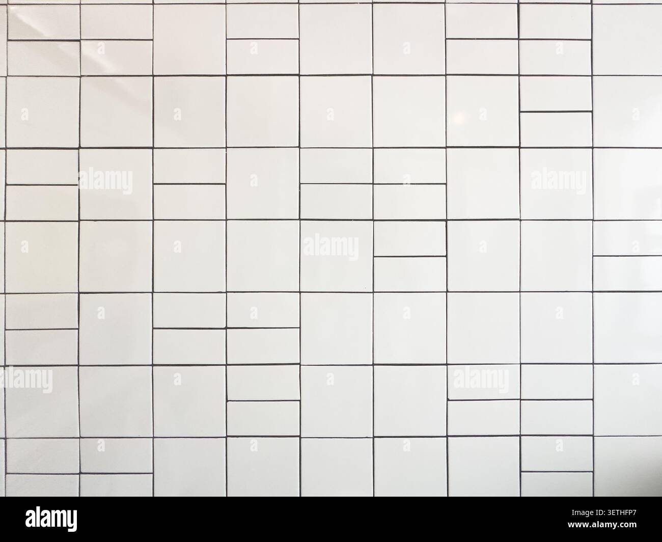 A view of a white ceramic tile surface, as a background. Stock Photo