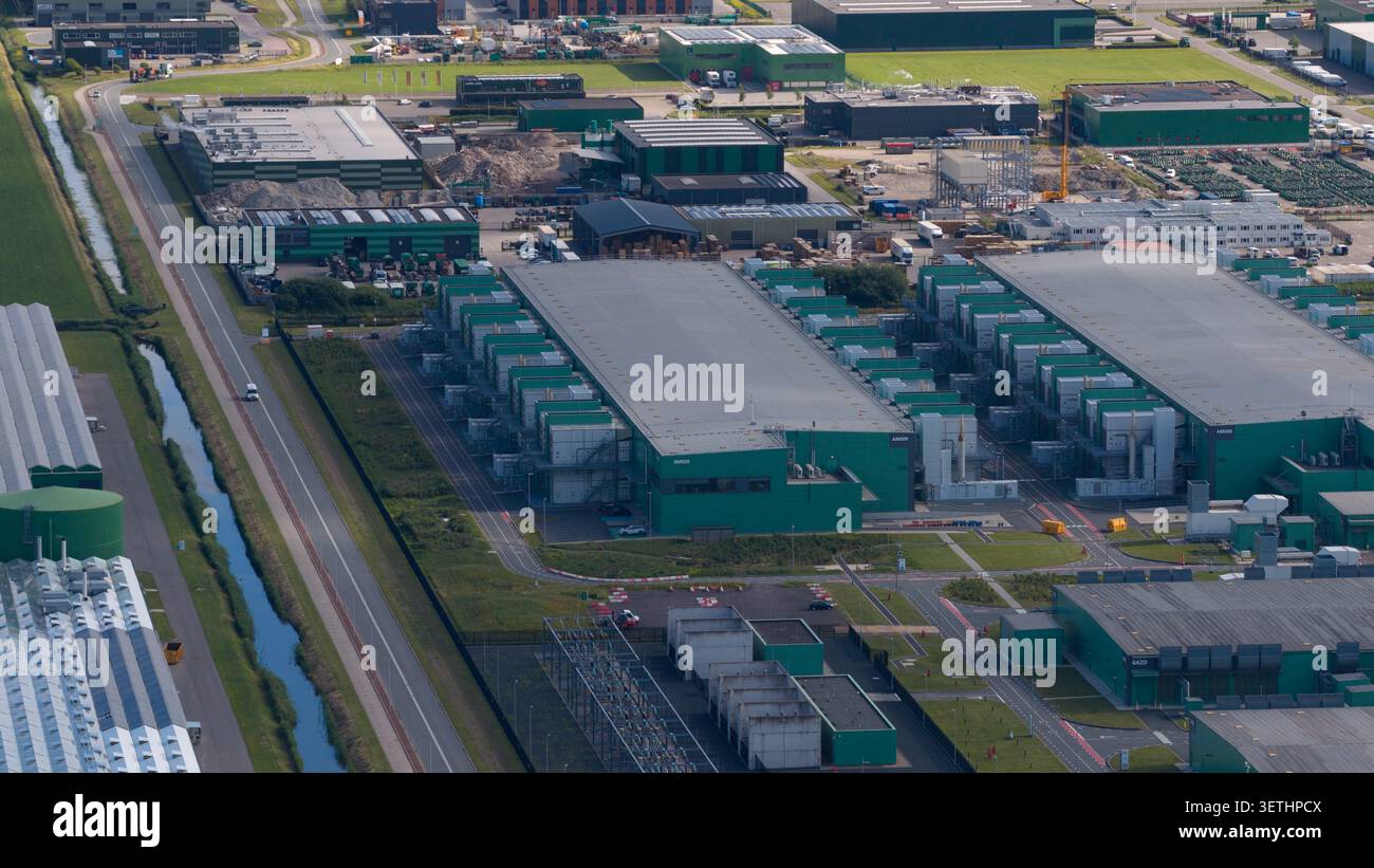 Aerial view of a massive hyperscale data center campus supporting cloud computing, big data, artificial intelligence and digital infrastructure. Stock Photo