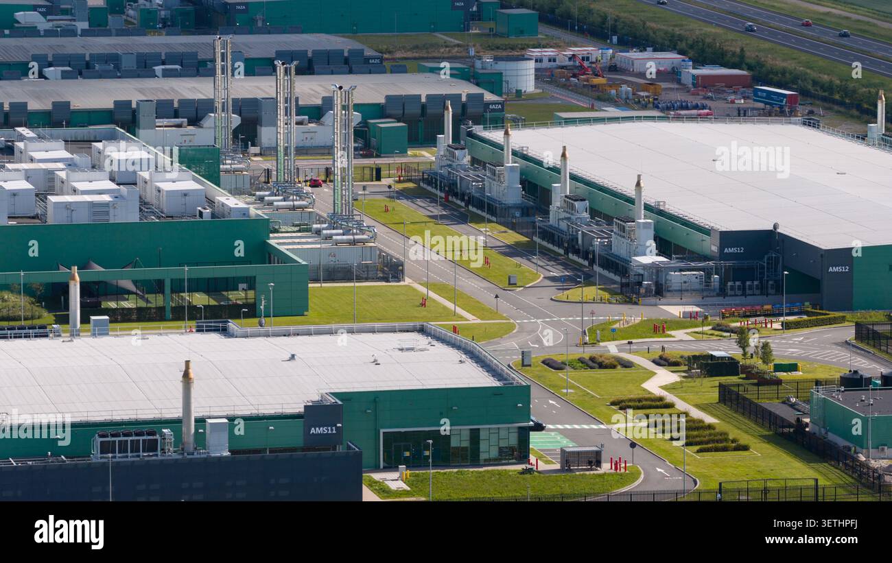 Aerial view of a massive hyperscale data center campus supporting cloud computing, big data, artificial intelligence and digital infrastructure. Stock Photo