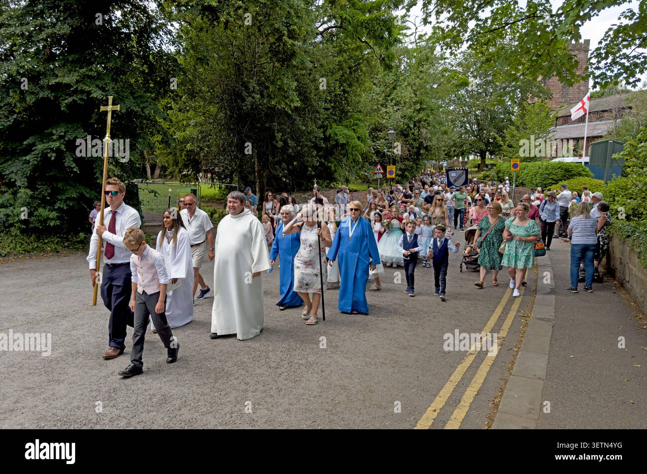 Grappenhall Walking Day procession crosses the Bridgewater Canal in Warrington, led by St Wilfrid's clergy, 20 June 2026 Stock Photo