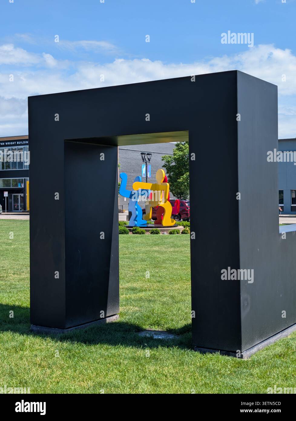 Marriage by Tony Smith frames Keith Haring piece at Pappajohn Sculpture Park in Des Moines Iowa Stock Photo