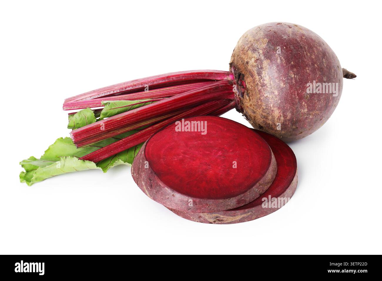 Whole and cut young beets with green leaves isolated on white Stock Photo