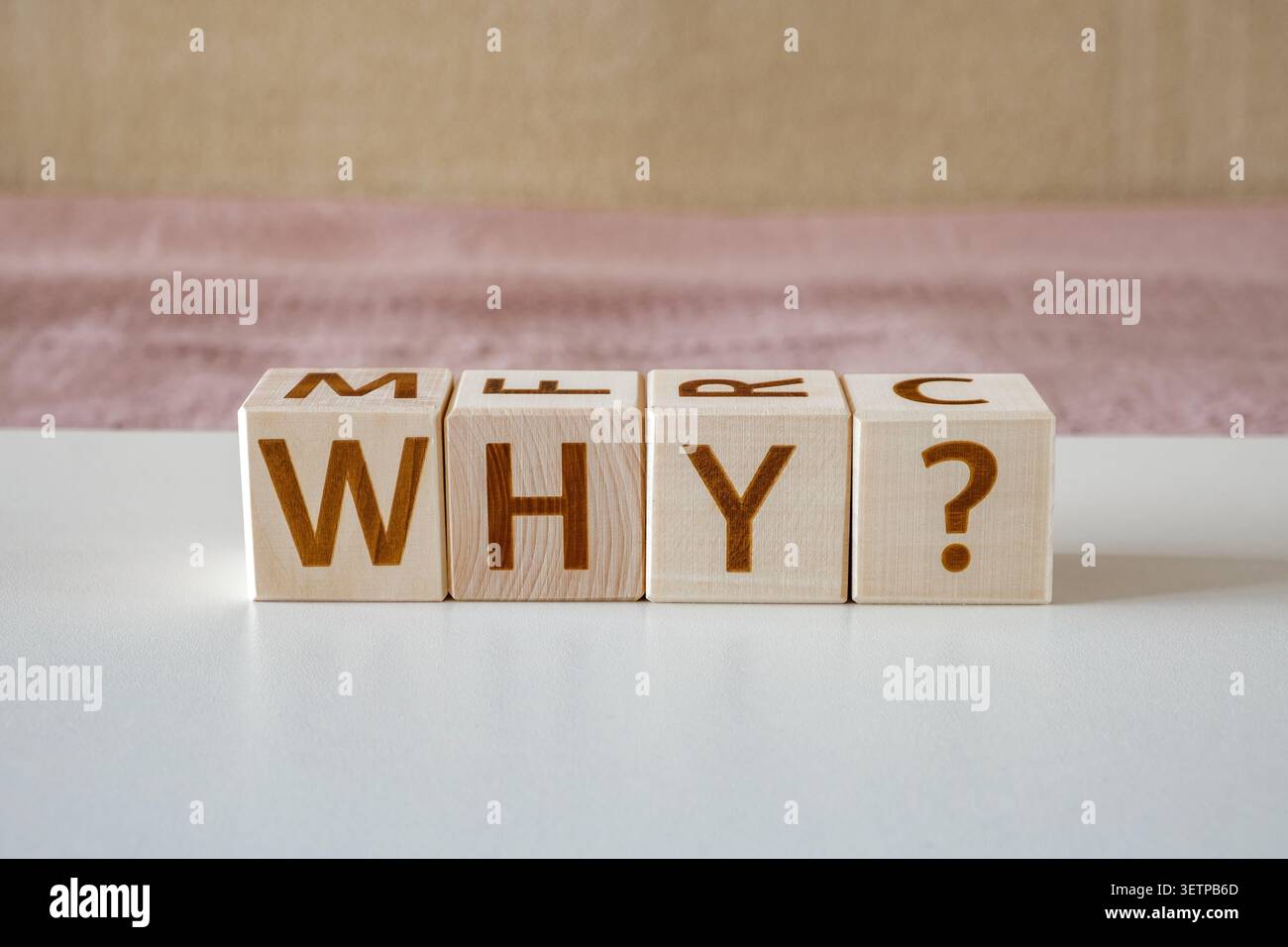 why ?, motivational word made of letters on wooden cubes Stock Photo