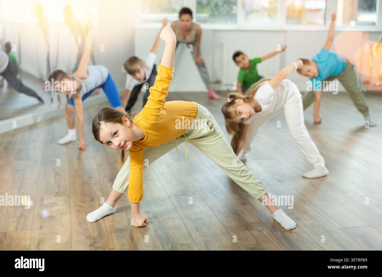 Group of children warming up before dance class Stock Photo