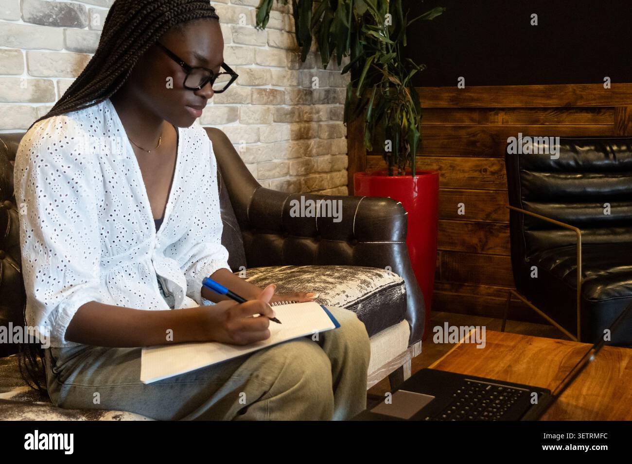 Woman wearing glasses braids hi-res stock photography and images - Alamy