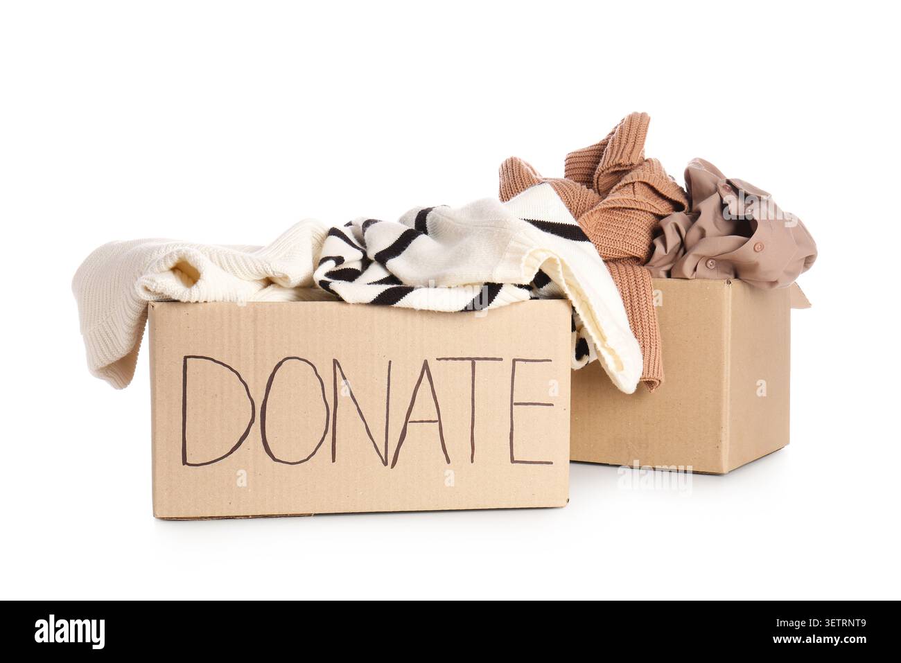 Cardboard boxes filled with clothes for donation Stock Photo