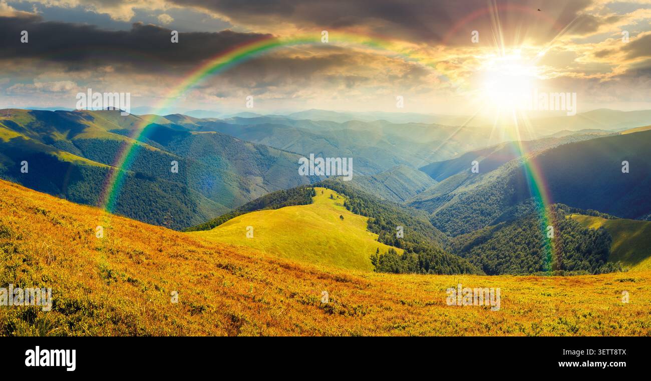 beautiful panorama of mountainous landscape at sunset. wide view of cloudy sky over the grassy slope of a mountain ridge. lovely summer weather with r Stock Photo