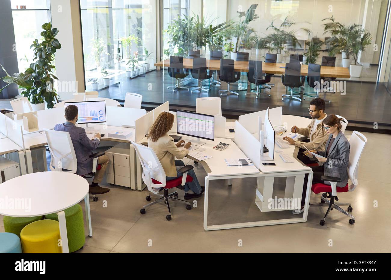 Finance analysts team working on data reports at modern open plan office Stock Photo