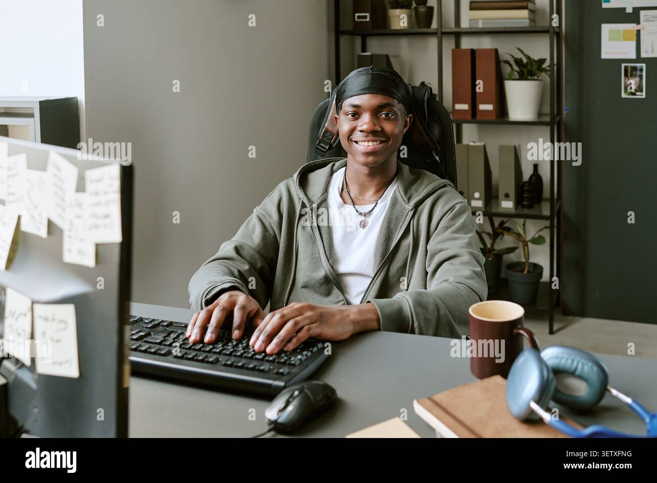Portrait of Black Man Working at Computer in Modern Office Stock Photo