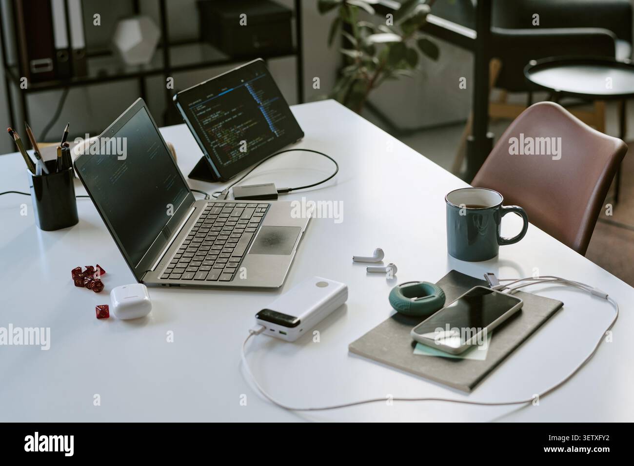 Remote Work Desk Setup Supporting Coding and Digital Productivity Stock Photo