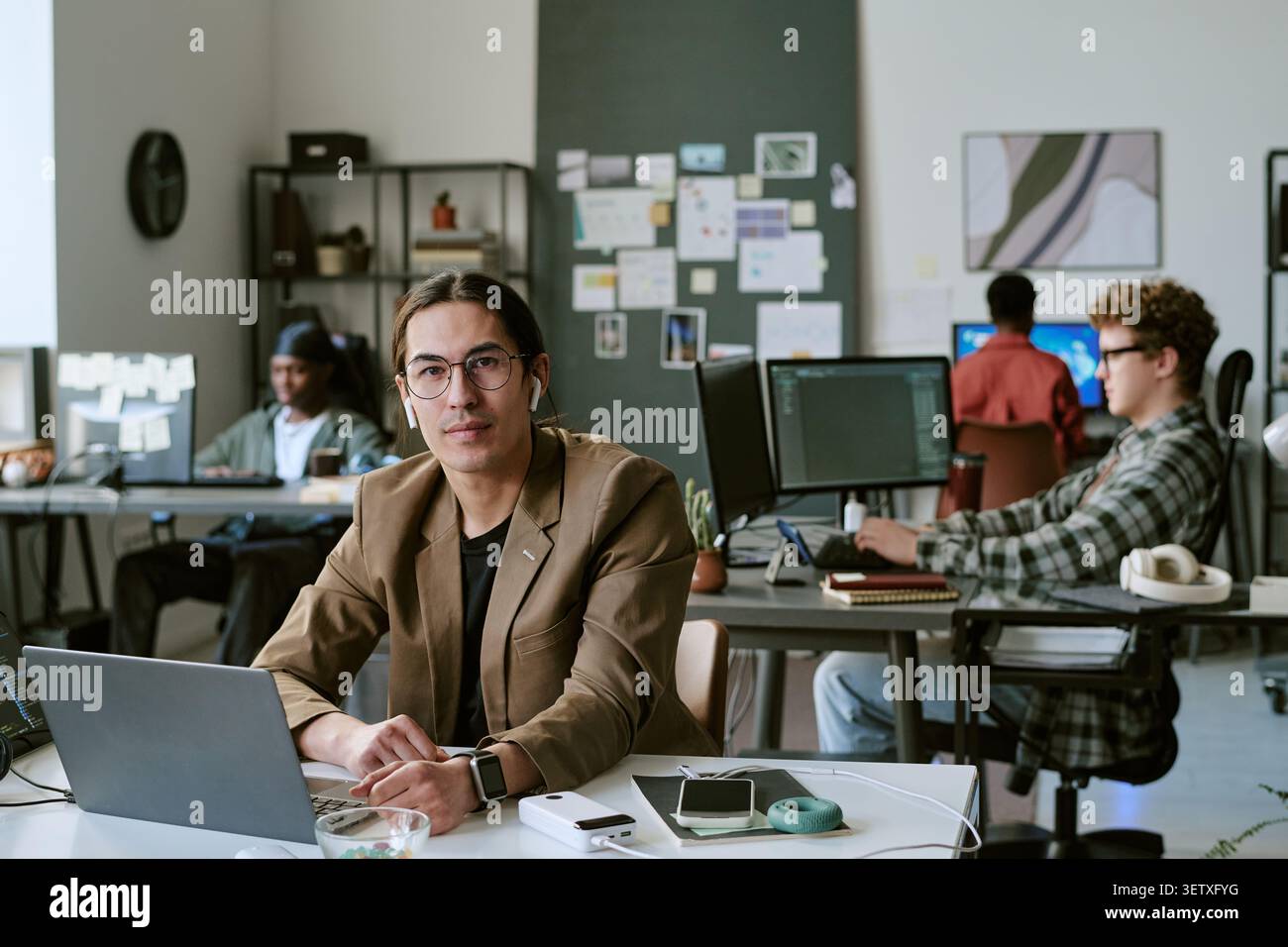 Portrait of Adult Man Working in Creative Office Team Environment Stock Photo
