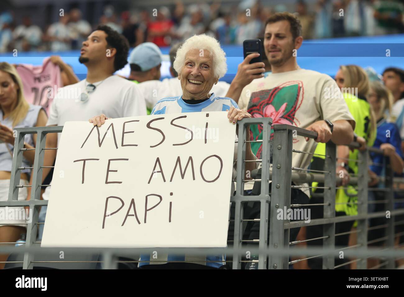 June Papi An elderly Lionel Messi fan with a banner that reads