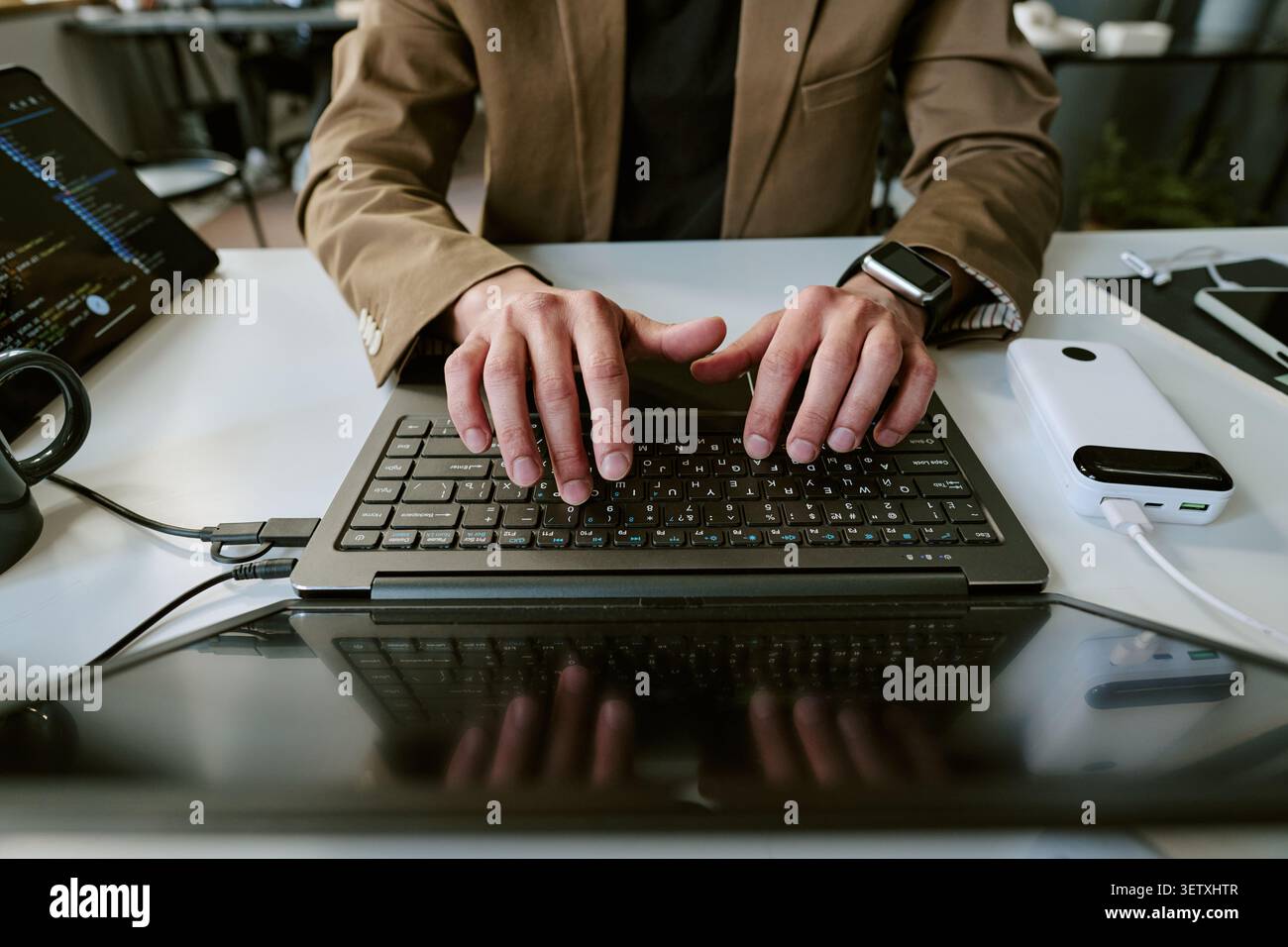 Adult Man Typing on Laptop for Software Development Work Stock Photo