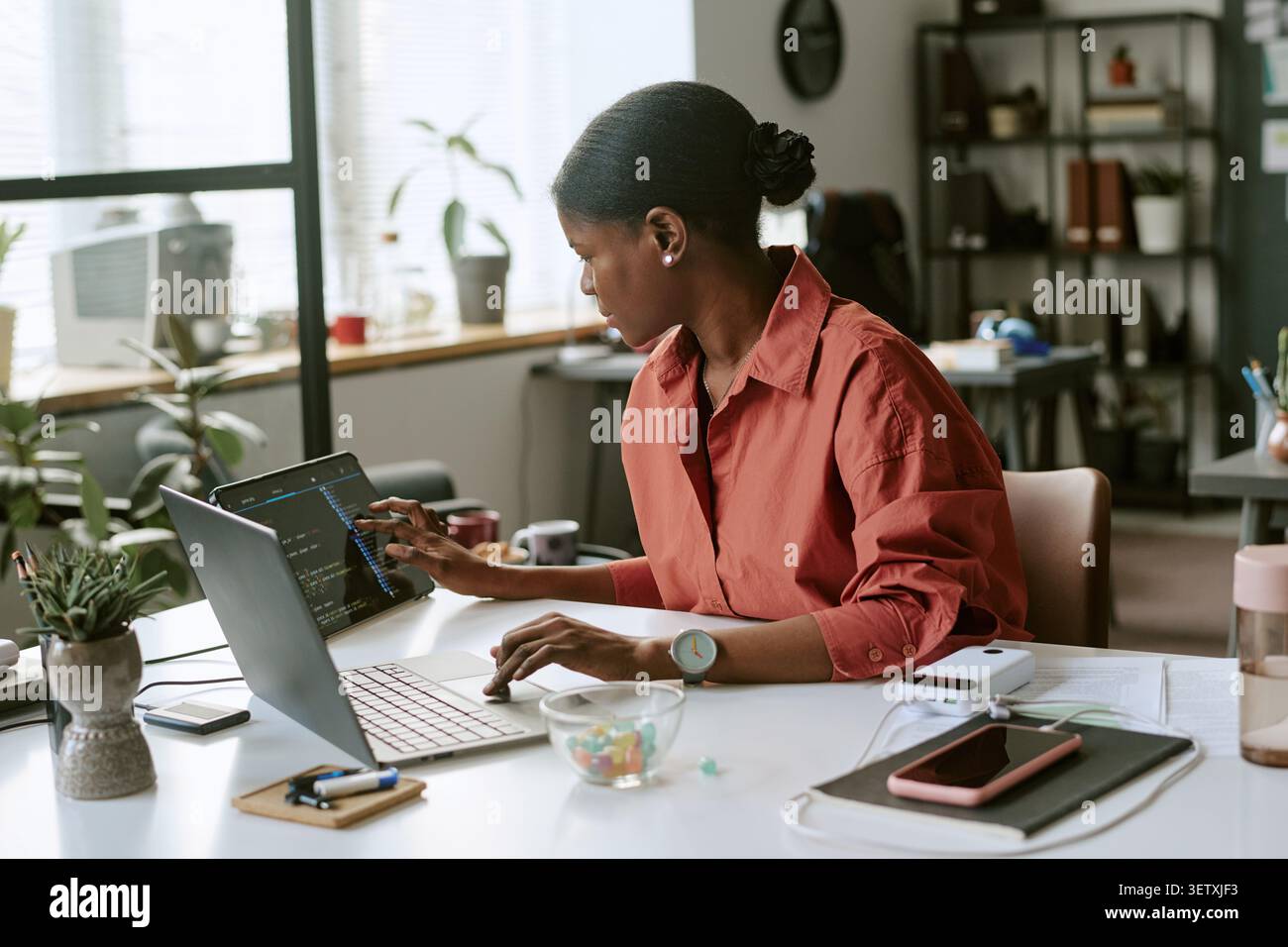 Black Woman Developer Working on Coding Project in Office Stock Photo