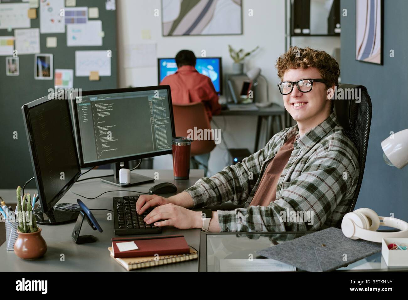Portrait of Man Coding at Startup Office Workspace Stock Photo