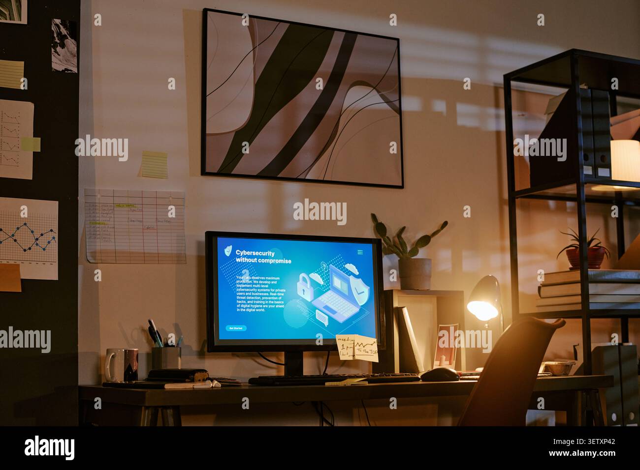 Office Workspace Displaying Cybersecurity Dashboard for Remote Work Stock Photo