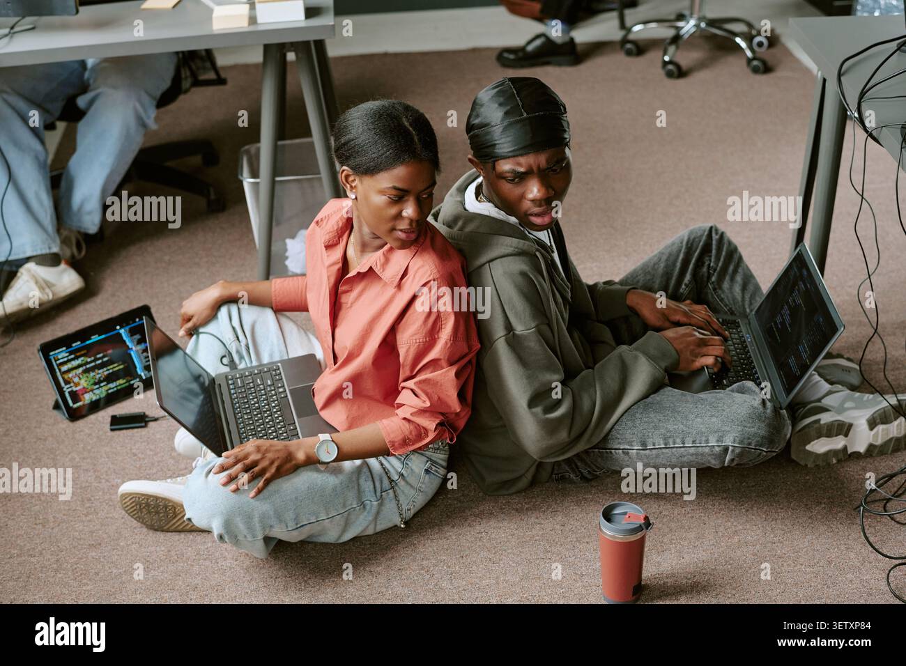 Black Colleagues Collaborating on Coding Project  Stock Photo