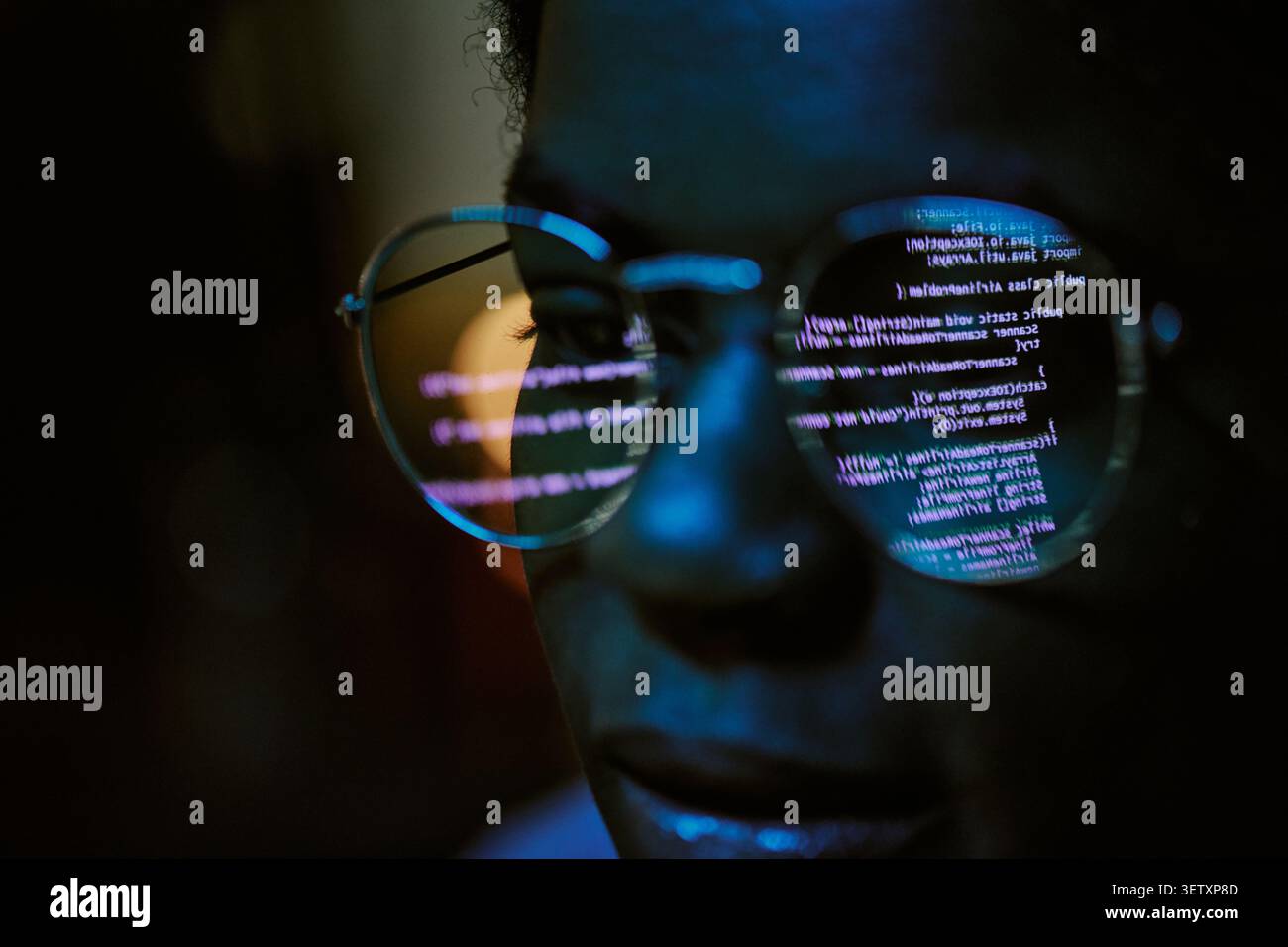 Black Woman Analyzing Code Reflection for Cybersecurity Work Stock Photo