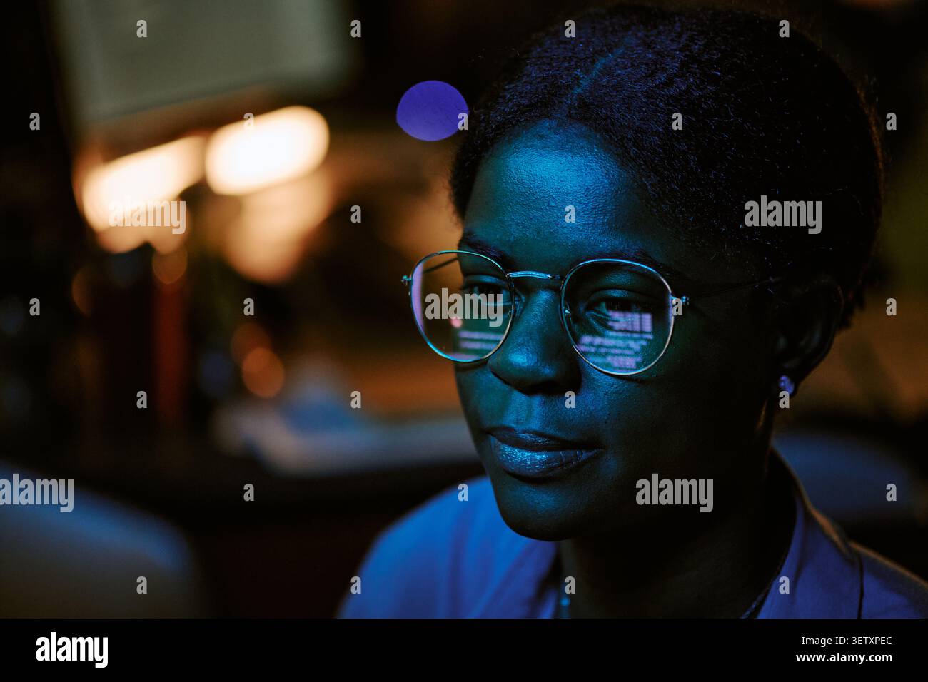 Black Woman Analyzing Data on Computer for Cybersecurity Work Stock Photo