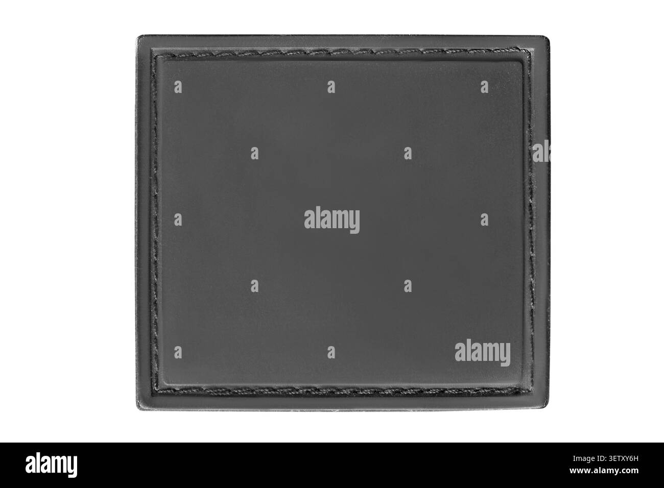 Blank black rubber stitched patch isolated on white background Stock Photo