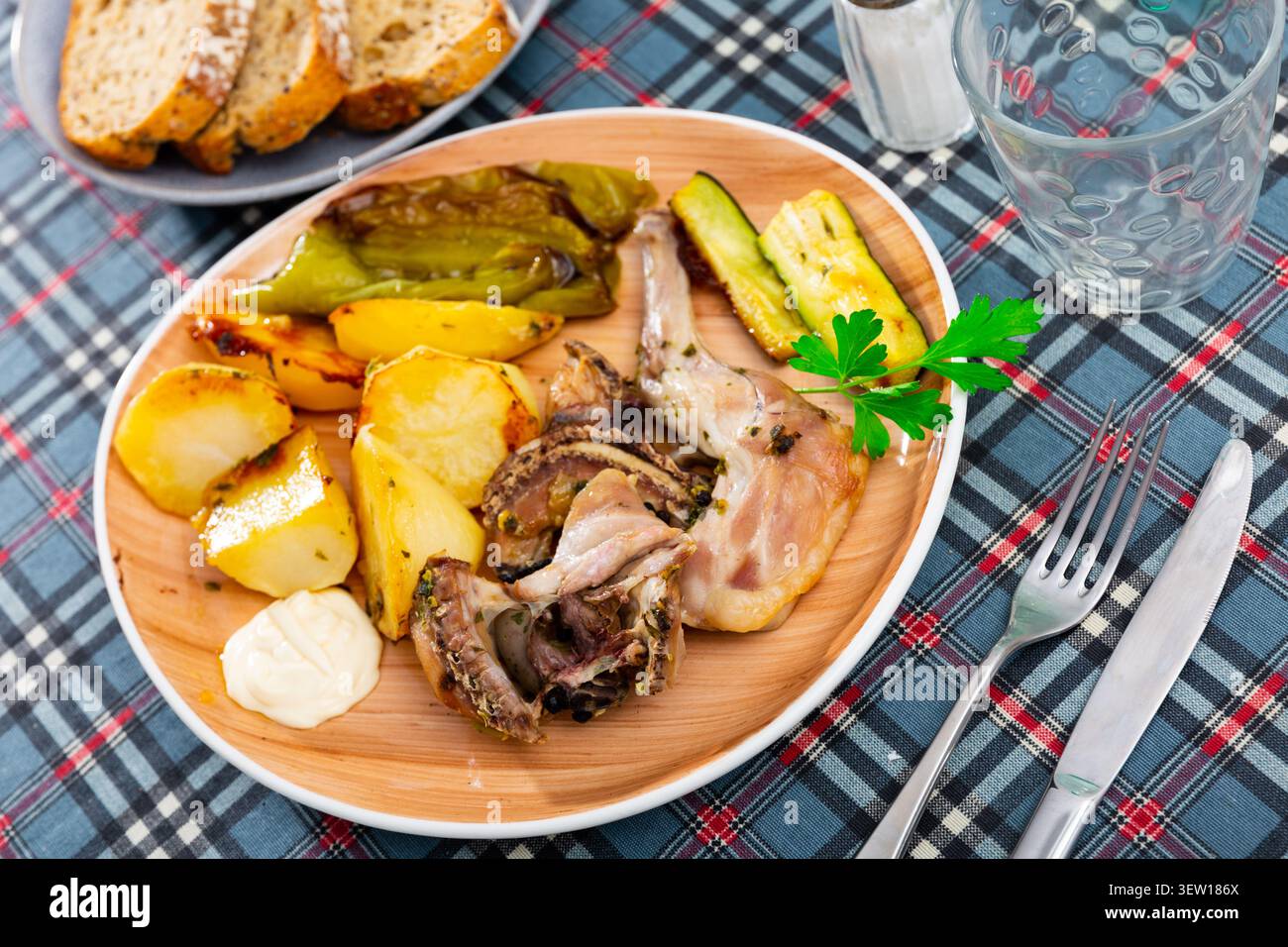 Roasted rabbit served with vegetable garnish Stock Photo