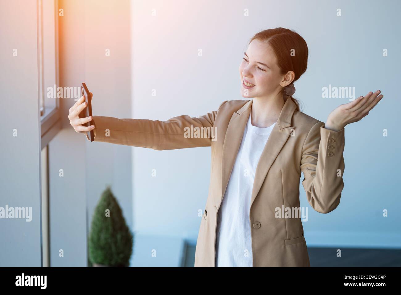 Young woman having video call using smartphone Stock Photo