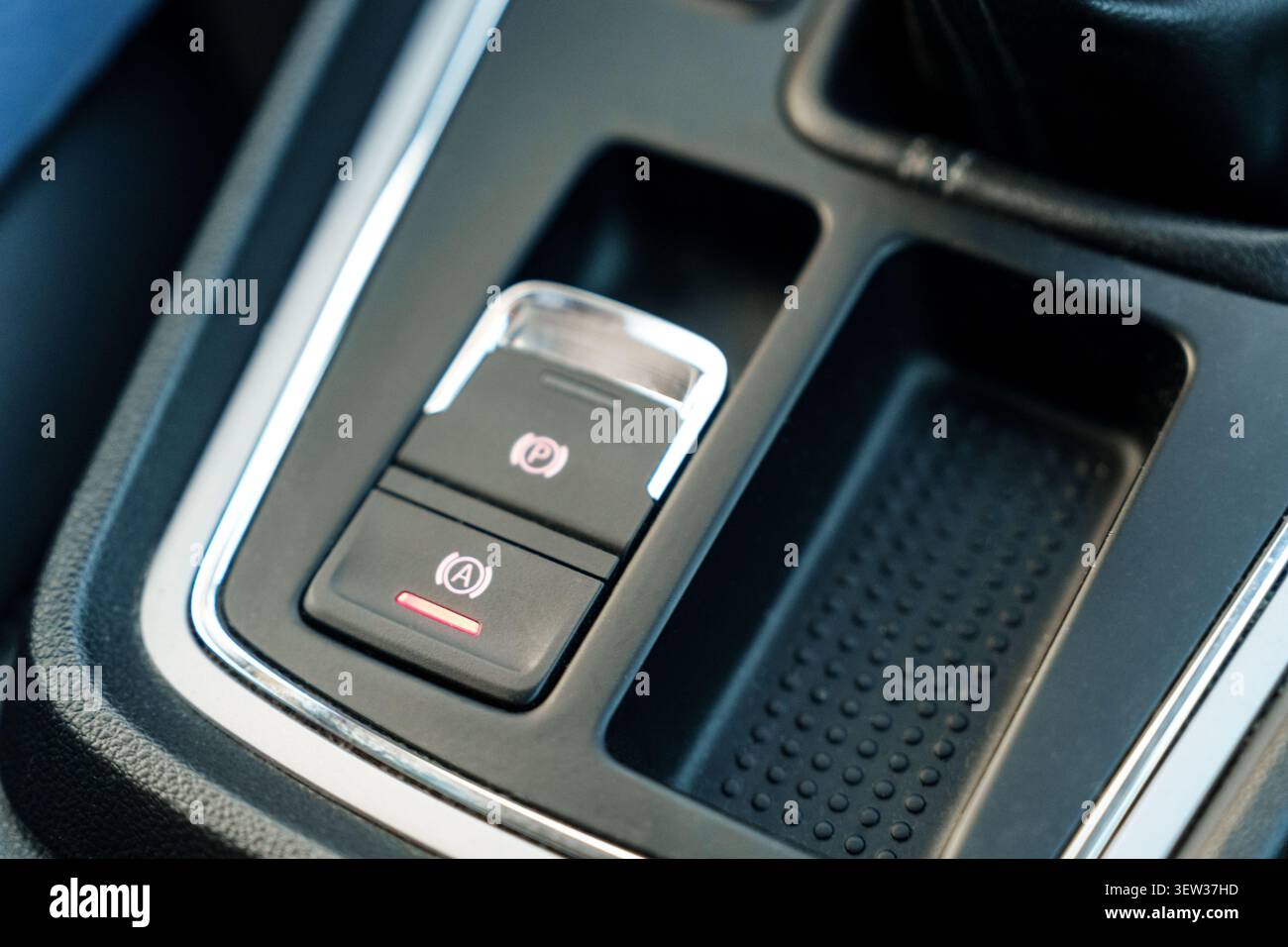 Electronic parking brake button in car interior Stock Photo