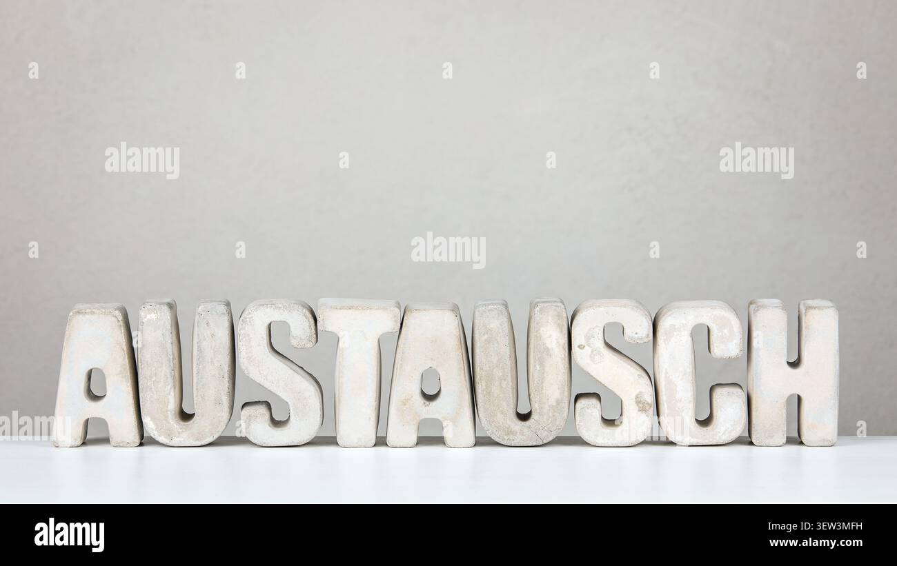 Exchange From German Word AUSTAUSCH Displayed With Solid Letters In Clean Neutral Scene Stock Photo