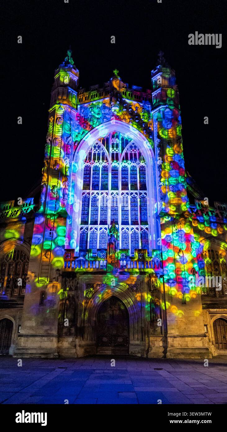 Bath Abbey illuminated at night with a vibrant projection light display during Christmas in Bath, Somerset. - Smartphone Captured Stock Image